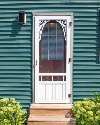 a blue house with a white door and a porch at Hamilton Home #4 in Hamilton