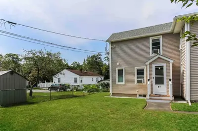 a home with a yard with a house at Two Bedroom Apartment on Forestville Bristol in Bristol