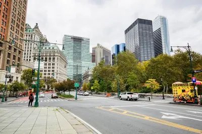 a city with tall buildings and a street at FiDi 1br w fitness center nr freedom tower NYC-1340 in New York