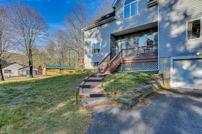 a house with a staircase leading to the front yard at Secluded Kerhonkson Retreat with Deck and Views! in Sundown