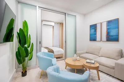 a living room with a couch and a table at 317-2A Sleek Modern 1Br UES W D in New York