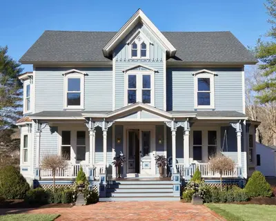 a blue house with a gray roof at The Kent Collection - The Victorian in Kent