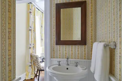 a bathroom with a sink and a mirror at The Kent Collection - The Victorian in Kent