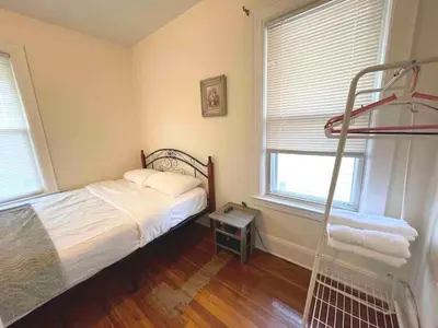 a bedroom with a bed and a ladder in it at Entire Beautiful 2BR Private Apartment [R] in Whitestone