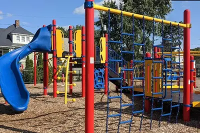 a playground with a blue and yellow slide at Comfy 4 Bed 1 Bath with Wi-fi in College Area in Springfield