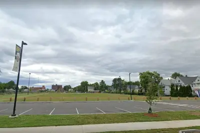 an empty parking lot with a parking lot at Comfy 4 Bed 1 Bath with Wi-fi in College Area in Springfield