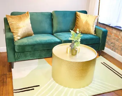 a living room with a couch and a coffee table at New York Style Stay near Central Park in New York