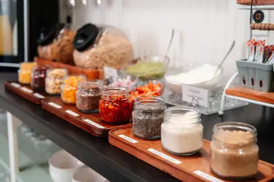a counter with jars of food and other food items at The Ellery in Northampton