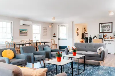 a living room with couches and tables at The Ellery in Northampton