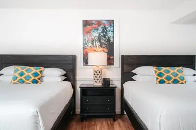 two beds sitting next to each other in a bedroom at The Ellery in Northampton