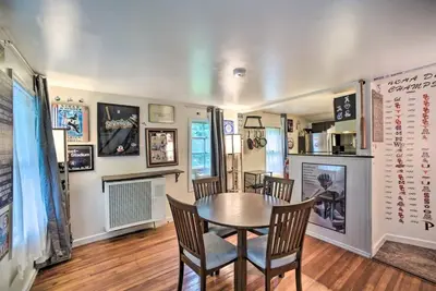 a dining room with a table and chairs at Cozy Milford Cottage on Half Acre w Deck & Grill in Milford