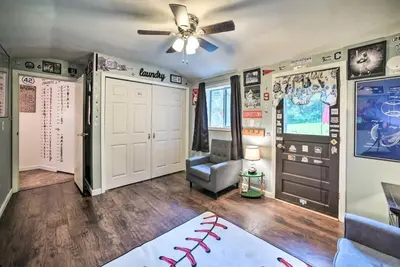 a baseball themed bedroom with a ceiling fan at Cozy Milford Cottage on Half Acre w Deck & Grill in Milford