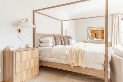 a bedroom with a large bed with a large mirror at 8BR Luxury Maplewood Manor, Hot Tub & Fire Pit in Jewett