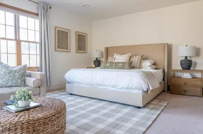 a bedroom with a large bed and a couch at 8BR Luxury Maplewood Manor, Hot Tub & Fire Pit in Jewett