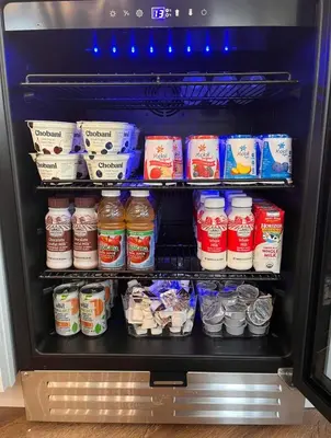 an open refrigerator filled with lots of food at Chalet 239-Boutique Hotel in West Dover