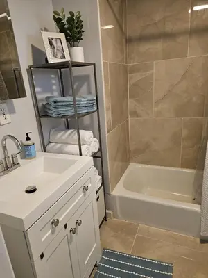 a bathroom with a sink and a tub and a shower at Bedroom walking distance to Yale Bridgeport Hospital in Bridgeport