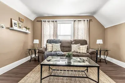 a living room with a couch and a table at A walk to Yale Bridgeport Hospital in Bridgeport