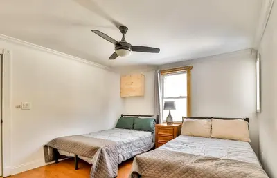 a bedroom with two beds and a ceiling fan at Matterhorns Hunter Lodge in Hunter