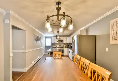 a kitchen and dining room with a table and chairs at Matterhorns Hunter Lodge in Hunter