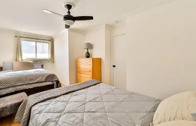 a bedroom with two beds and a window at Matterhorns Hunter Lodge in Hunter
