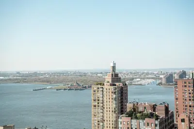 a view of a city with a river and a building at Financial District 1br w WD gym elevator NYC-1376 in New York