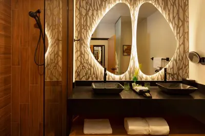 a bathroom with two sinks and a large mirror at The Swiftwater in Swiftwater