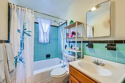a bathroom with a tub and a sink and a toilet at Mount Vernon Getaway - 4 Mi to the Bronx Zoo! in New Rochelle