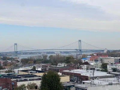 a view of a bridge over a city with buildings at Ly New York Hotel in College Point