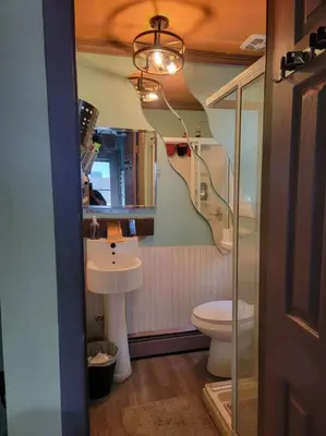a bathroom with a sink and a toilet at Rock Pad AirBnB in New Haven
