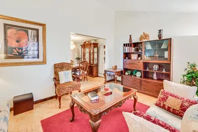 a living room with a couch and a table at Vintage Windsor Home Private Yard and Covered Deck in Windsor
