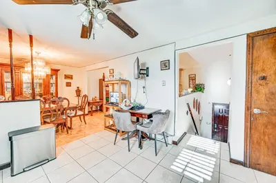 a kitchen and dining room with a ceiling fan at Vintage Windsor Home Private Yard and Covered Deck in Windsor