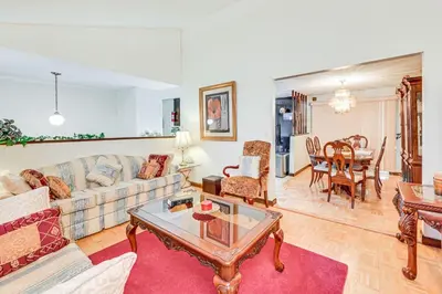 a living room with a couch and a table at Vintage Windsor Home Private Yard and Covered Deck in Windsor