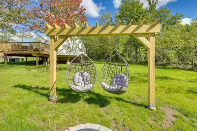 two baskets hanging from a wooden pergola in a yard at Unique Escapes - 007 Geodome in Monticello