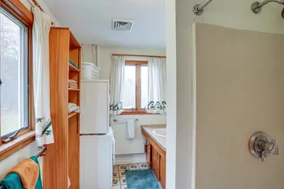 a kitchen with a white refrigerator and a sink at Hawley Home with Deck 4 Mi to Berkshire East Resort in Hawley