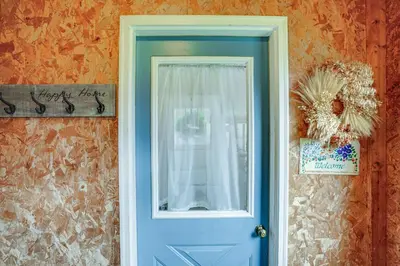 a blue door with a window and a wreath on it at Hawley Home with Deck 4 Mi to Berkshire East Resort in Hawley