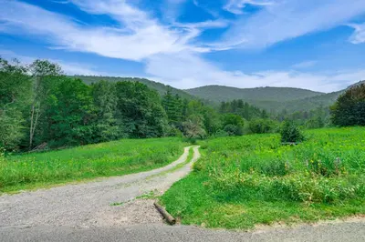 a dirt road in the middle of a field at Hawley Home with Deck 4 Mi to Berkshire East Resort in Hawley