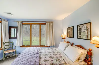 a bedroom with a bed and a window at Hawley Home with Deck 4 Mi to Berkshire East Resort in Hawley