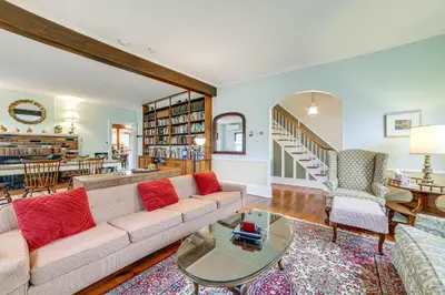 a living room with a couch and a table at Fly Creek Historic Home By Cooperstown! in Fly Creek