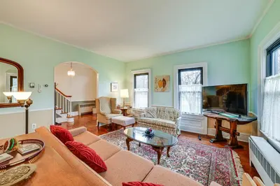 a living room with a couch and a table at Fly Creek Historic Home By Cooperstown! in Fly Creek