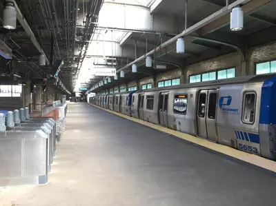 a subway station with a train in a building at Free Parking in Prime Area w King bd in Newark