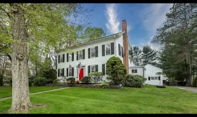 a large white house with a red door at Antique1242 British Bed & Breakfast in Enfield