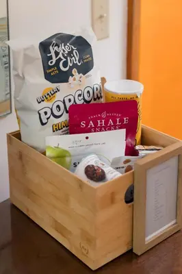 a wooden box filled with food and snacks on a table at Berkshire Valley Inn in Williamstown