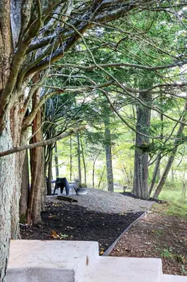 a park with a bench and some trees at WOODSTOCK HISTORIC ARTIST ESTATE - THE MUSEUM HOUSE in Woodstock