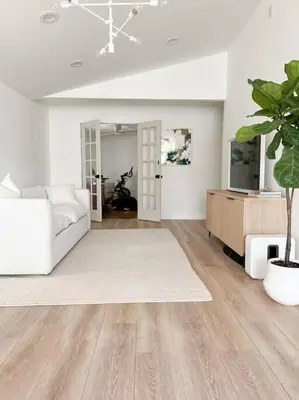 a living room with a white couch and a tv at Luxury Poconos Home Near Skiing, Lakes, & Waterparks in Tobyhanna