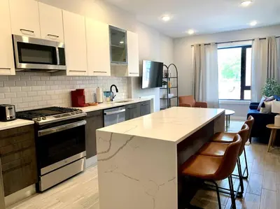 a kitchen with a stove and a counter top at Veau3 1BD 1BA minutes to NYC in Newark