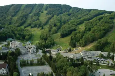 an aerial view of a village in a mountain at Deluxe Mountain Fox Suite Jiminy Peak - Ski On Off - Fully Redone Decor in Hancock