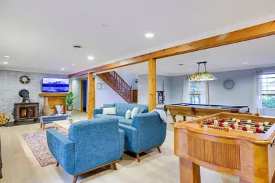 a living room with a pool table and ping pong ball at Luxury Villa with Year Round Heated Pool, Sauna, Spa & Fire Pit - Newly Redone in East Stroudsburg