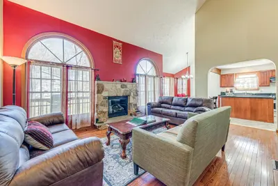 a living room with a couch and a fireplace at 11 Mi to Camelback Resort Tobyhanna Home! in Tobyhanna