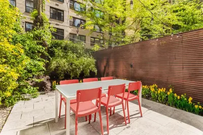 a table and four chairs sitting around a table at Private Beautiful Townhome w Zen Garden in New York