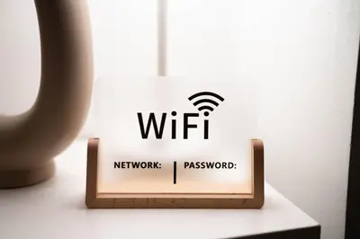 a sign with the wifi logo on a table at Private room with private bathroom and backyard in Brooklyn